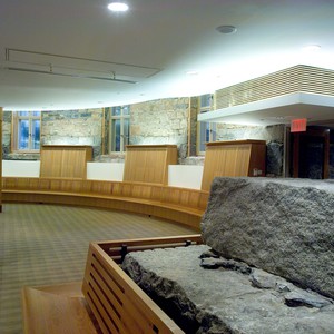 Wood benches with against a granite backdrop make this a viable and beautiful space.