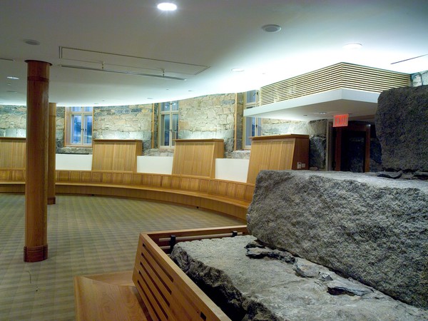 Wood benches with against a granite backdrop make this a viable and beautiful space.