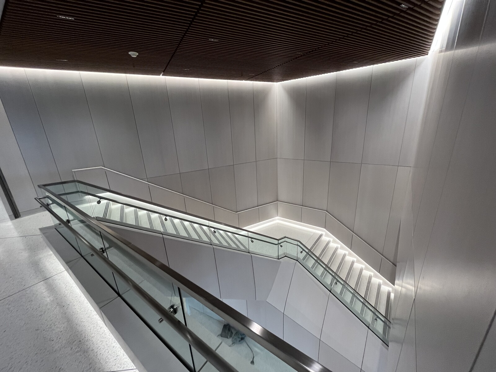 Unique angles, modern touches and warm wood adorn this lobby entryway